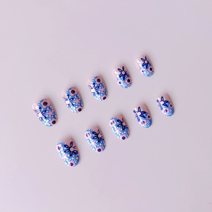 Nail art set with floral accents and vibrant patterns Kalsten