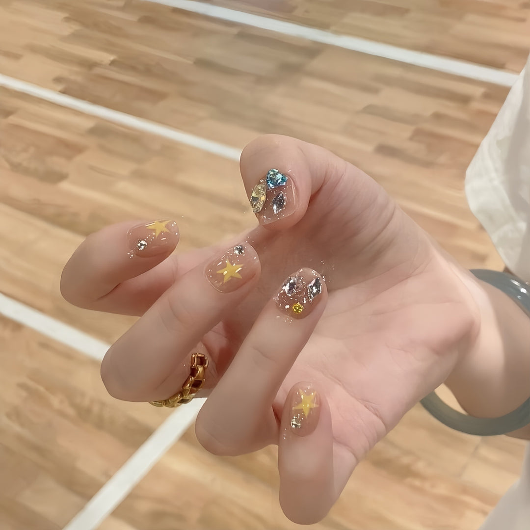Glittering nail tips with elegant jewelry accents Kalsten