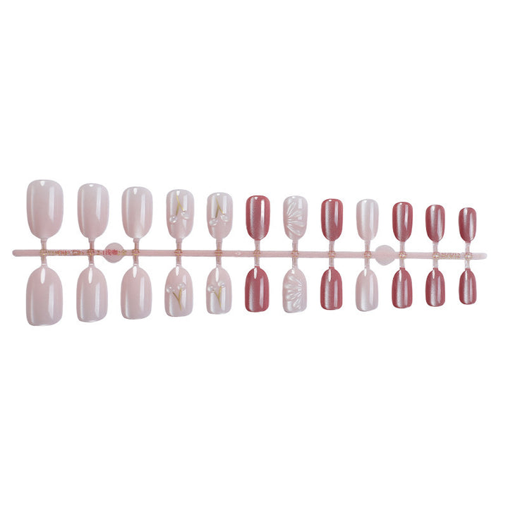 Acrylic nail set with elegant high-gloss finish and creative embellishments Kalsten