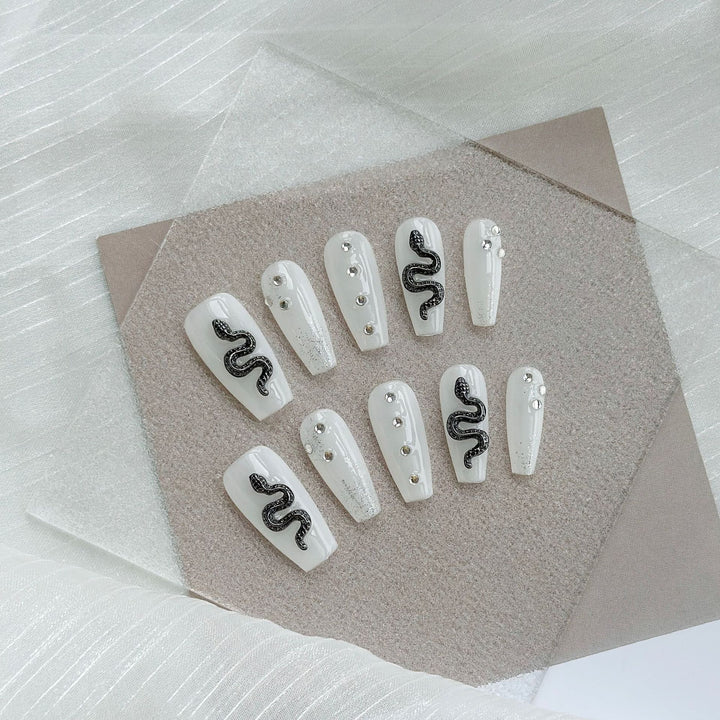 Artistic Press-On Nail Art Set with Heart and Celestial Designs
