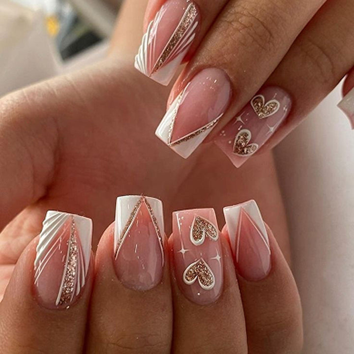 Artful Nail Art with Heart Design and Glitter Effects Kalsten