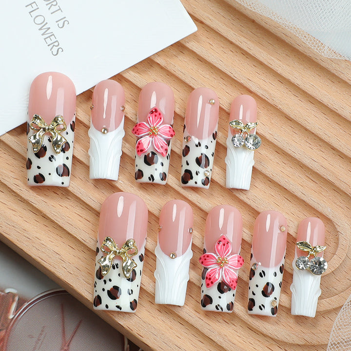 Acrylic nail set with elegant leopard design and floral accents Kalsten