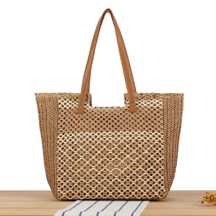Shopping bag made of woven natural material with elegant leather handles Kalsten