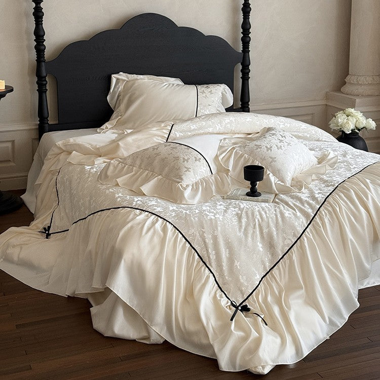 Jacquard bedding set with ruffle, decorative ribbons and fine piping