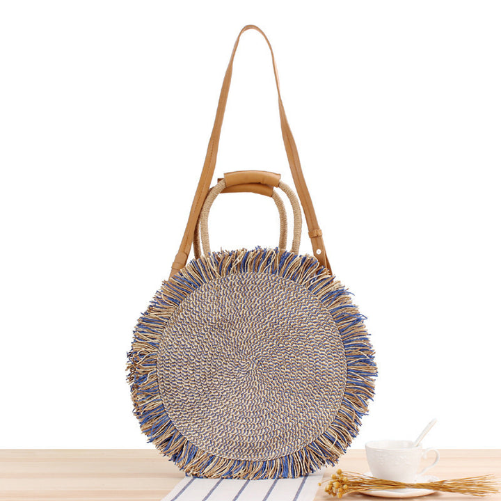 Round bag with fringe decoration Made of woven material Kalsten