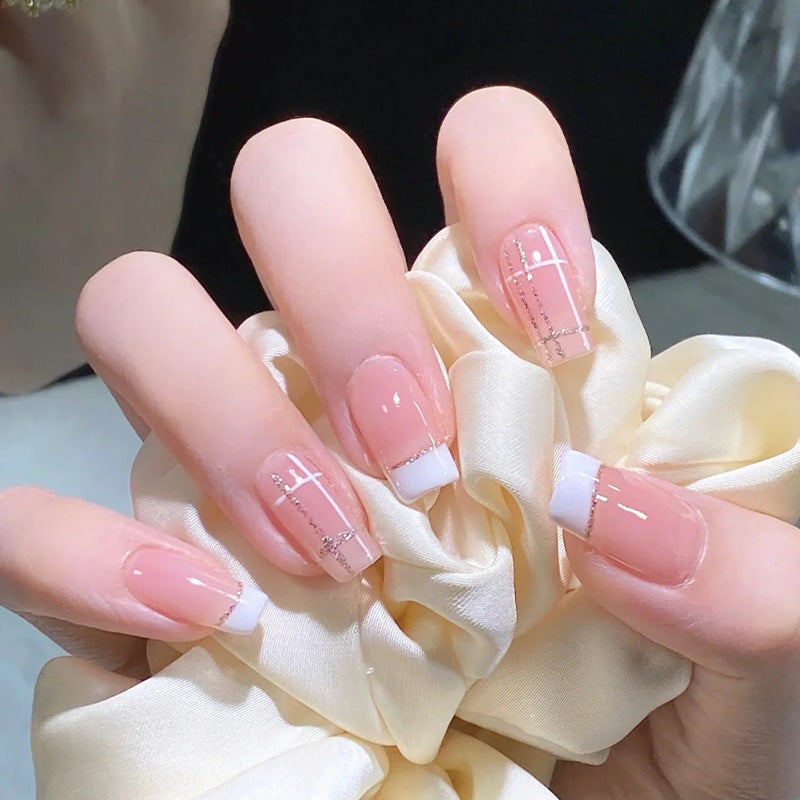 Nail set with elegant French tip and fashionable embellishments Kalsten