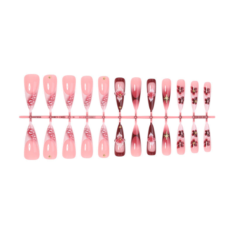 Artifical nail set with delicate floral design and glamorous accents Kalsten