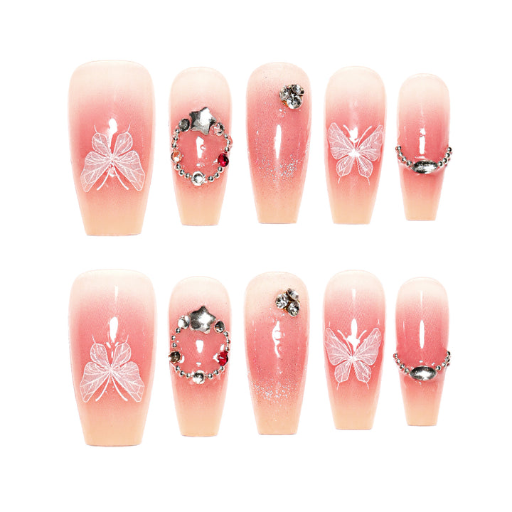 Artificial nail extensions with floral design and sparkling accents Kalsten