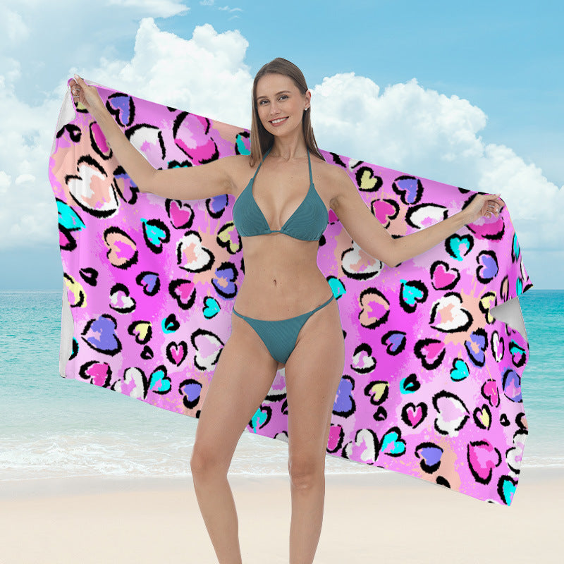 Beach towel with vibrant tropical plant motif Kalsten