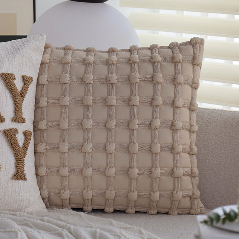 Square decorative cushion cover made of mottled bouclé weave with subtle piping Kalsten