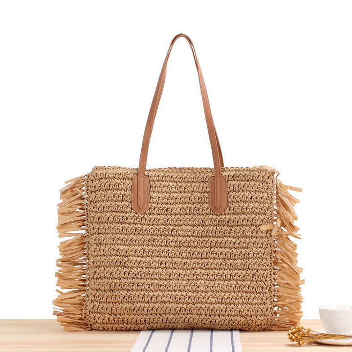 Beach bag with fringed design made of natural woven material Kalsten