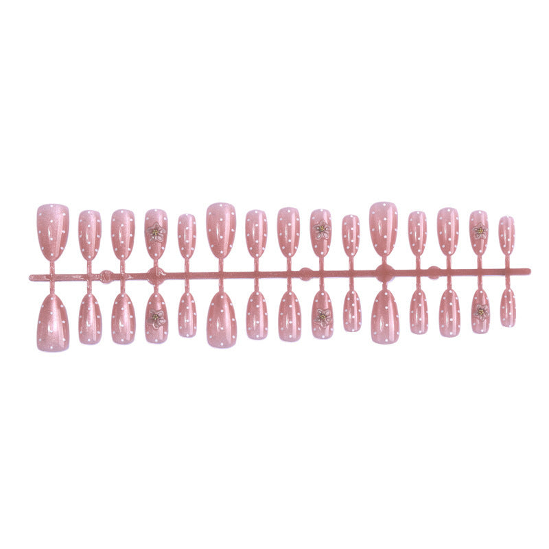 Artificial nail set with glitter and delicate floral and rhinestone embellishments Kalsten