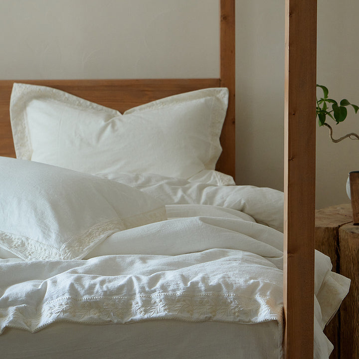 Cotton gauze bedding set with fine tone-on-tone floral embroidery and ruffle