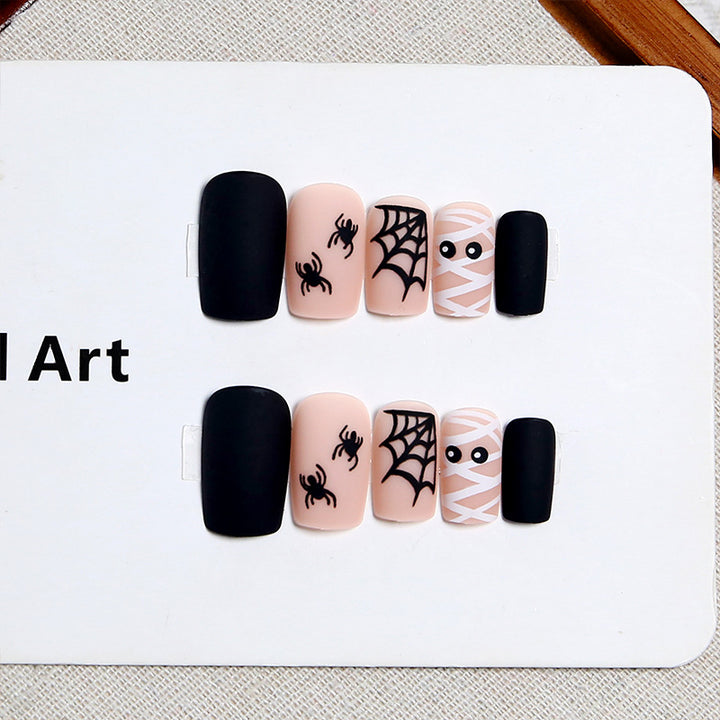 Artificial nail set with creepy Halloween motif and delicate spider designs Kalsten