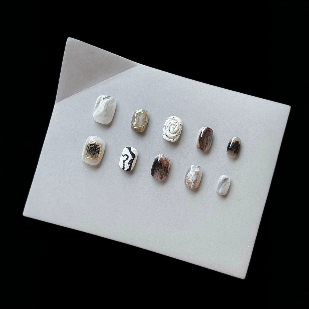 Artistic Press-On Nail Set with Modern Marble and Metallic Accents