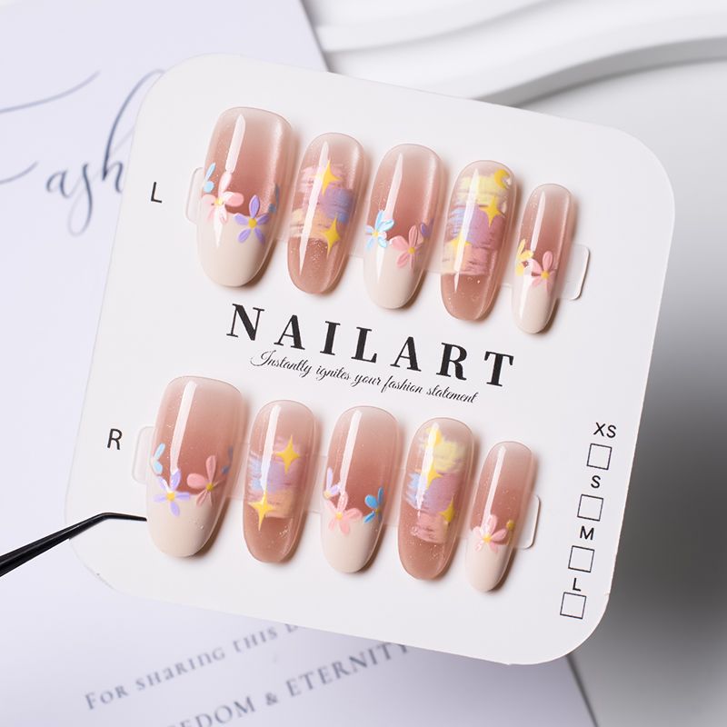Artificial nails with delicate floral accents and glitter effects Kalsten