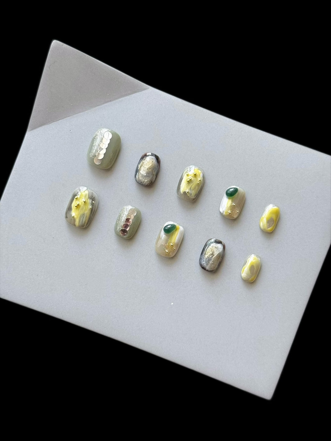 Artistic Press-On Nail Set with Floral and Metallic Accents