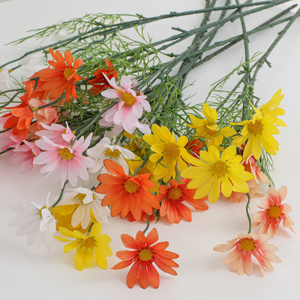 Artificial flower branch with bright blooms and delicate leaves