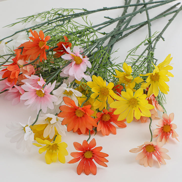 Artificial flower branch with bright blooms and delicate leaves