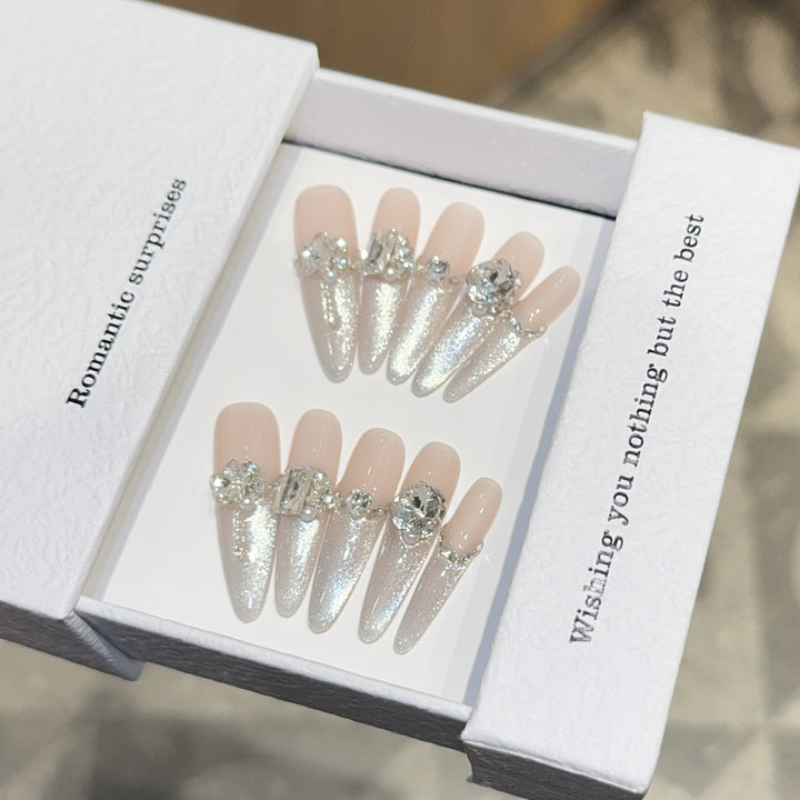 Glamorous artificial nails with sparkling rhinestone embellishments Kalsten