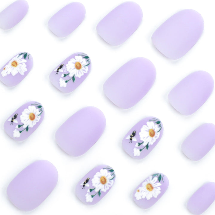Artistic nail design with delicate floral elements Kalsten
