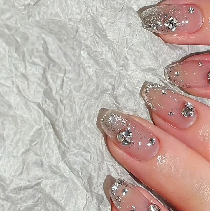 Acrylic nail set with extravagant glitter and crystal embellishments Kalsten