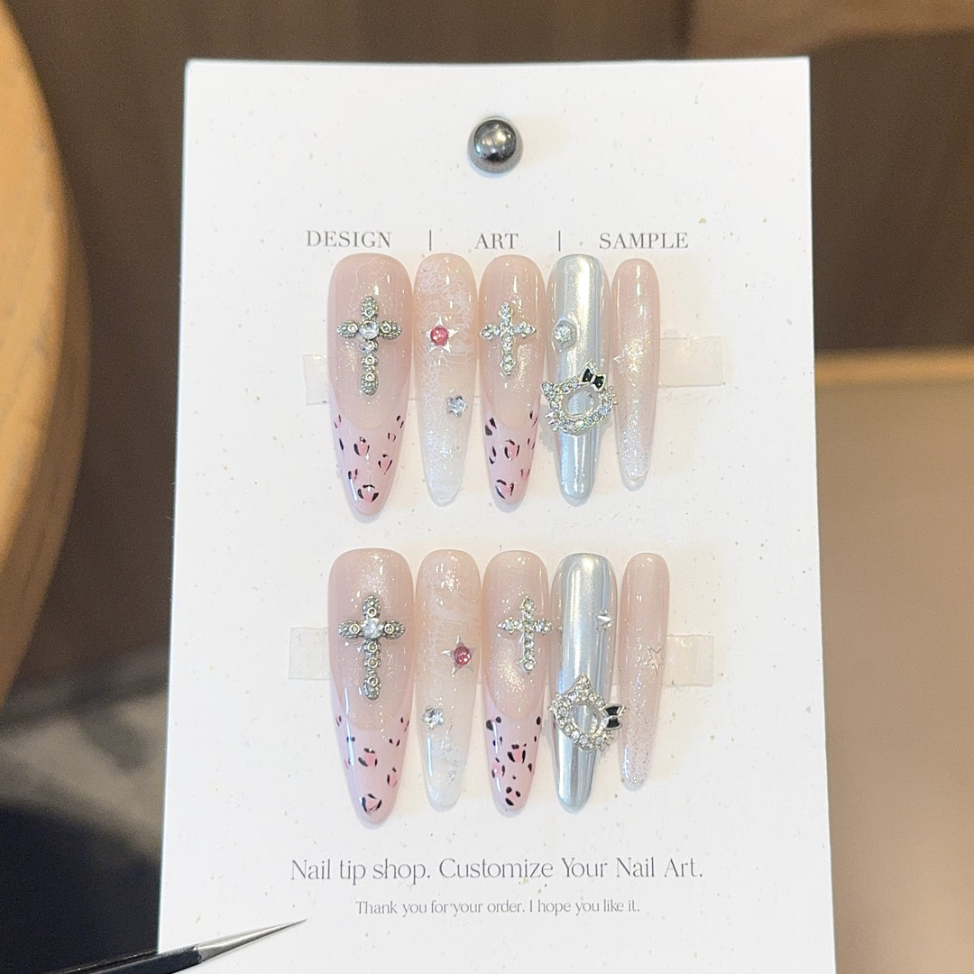 Artificial nails with sparkling rhinestones and cross motifs Kalsten