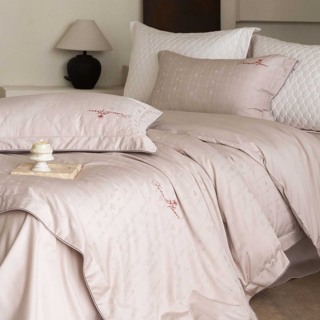 Luxurious satin bedding complete set with quilted cover and delicate logo embroidery