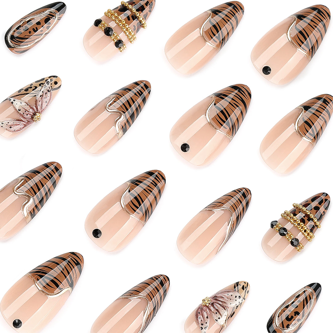 Artful stiletto nail with floral accents and gold embellishments Kalsten
