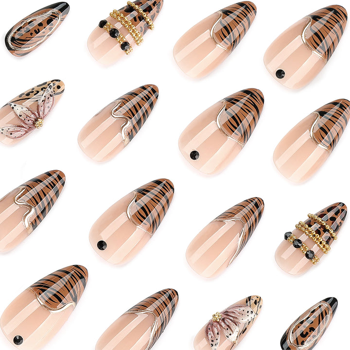 Artful stiletto nail with floral accents and gold embellishments Kalsten