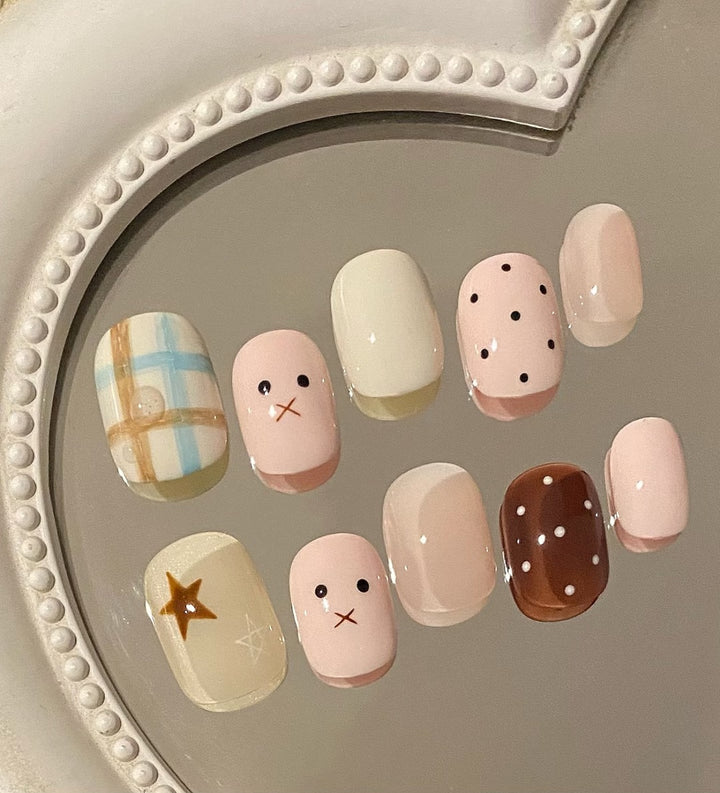 Artistic Press-On Nail Art Set with Whimsical Designs