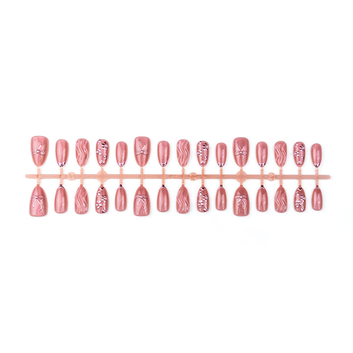 Nail art set with elegant bows and pearl accents Kalsten