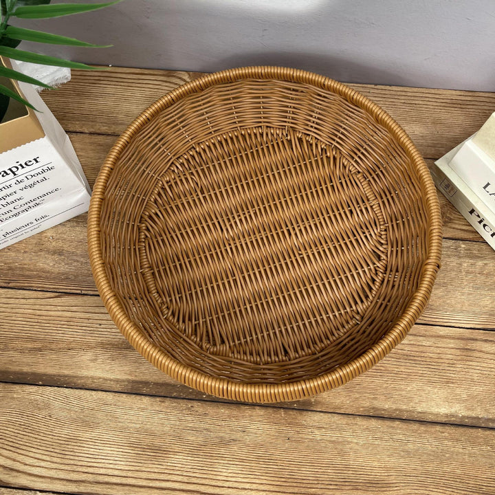 Women’s round serving basket made of woven rattan Kalsten