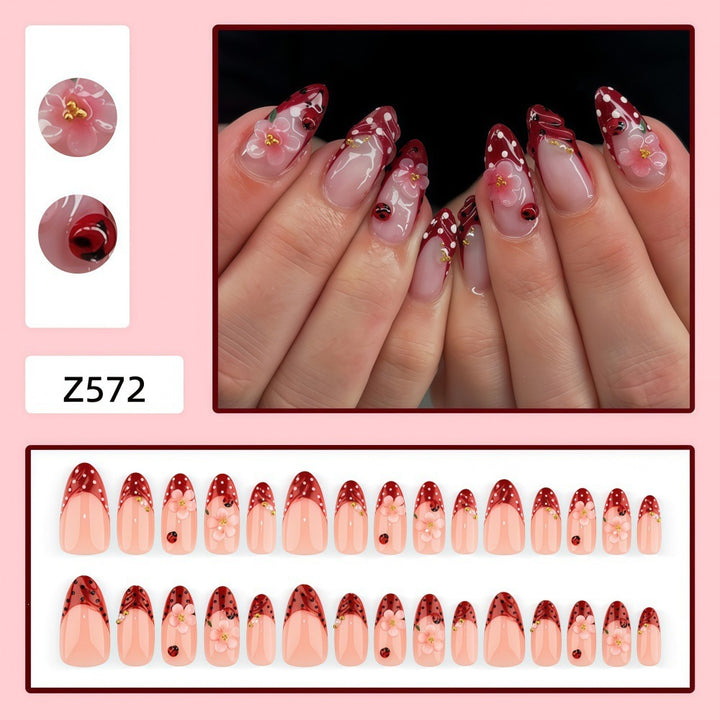 Creative tip design artificial nails with floral accents Kalsten