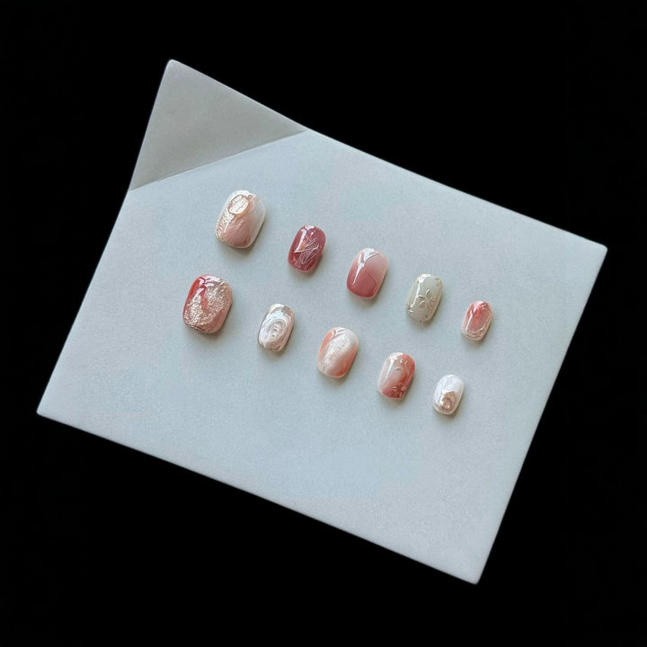 Artistic Press-On Nail Set with Marble and Metallic Accents