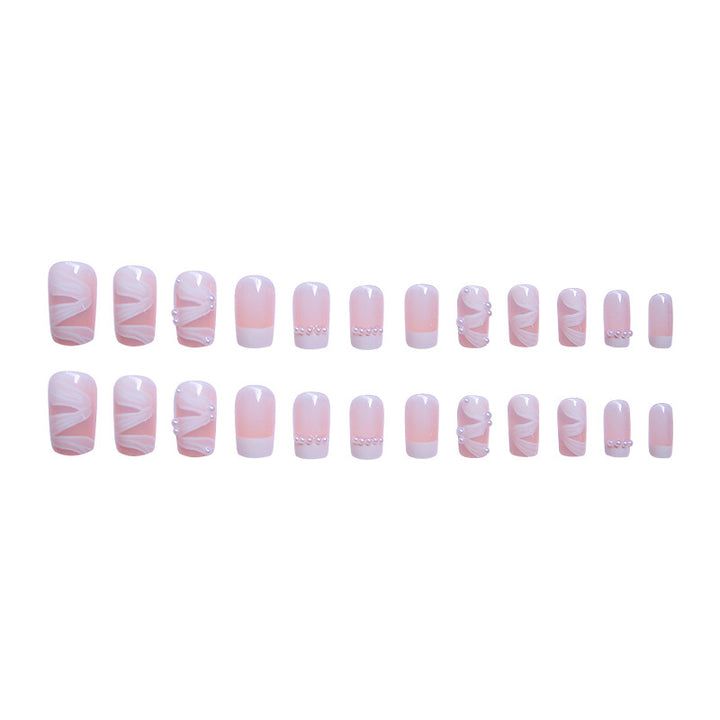 Elegant artificial nail set with stylish wave pattern and pearl accents Kalsten