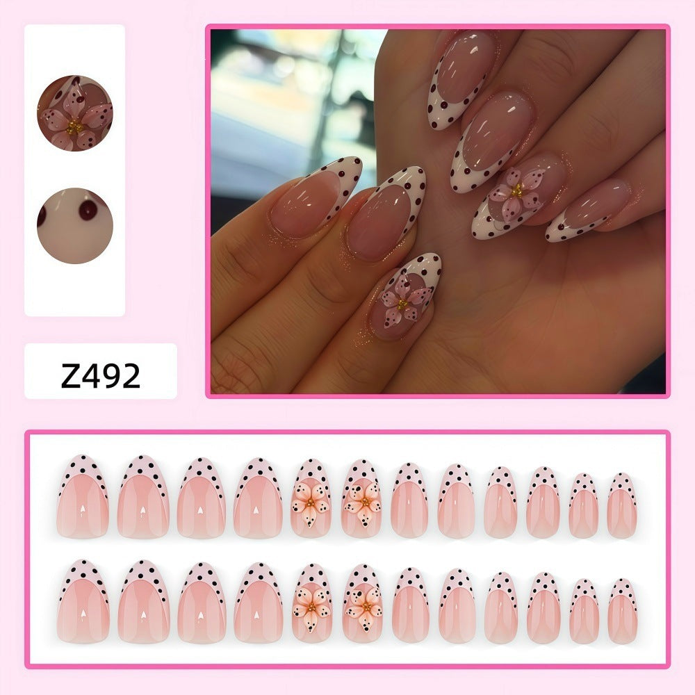 Creative artificial nails with floral design and glamorous accents Kalsten