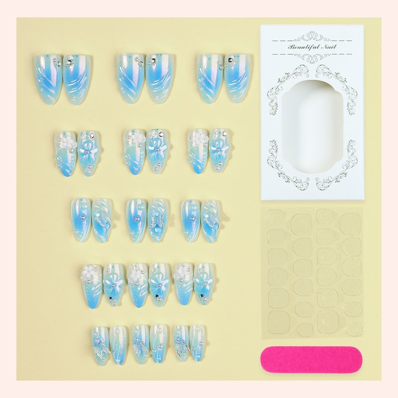 Creative nail set with floral accents and glittering details Kalsten