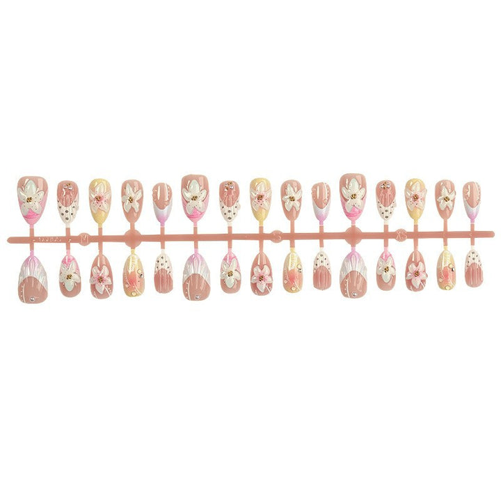 Nail art set with elegant floral design and glitter accents Kalsten