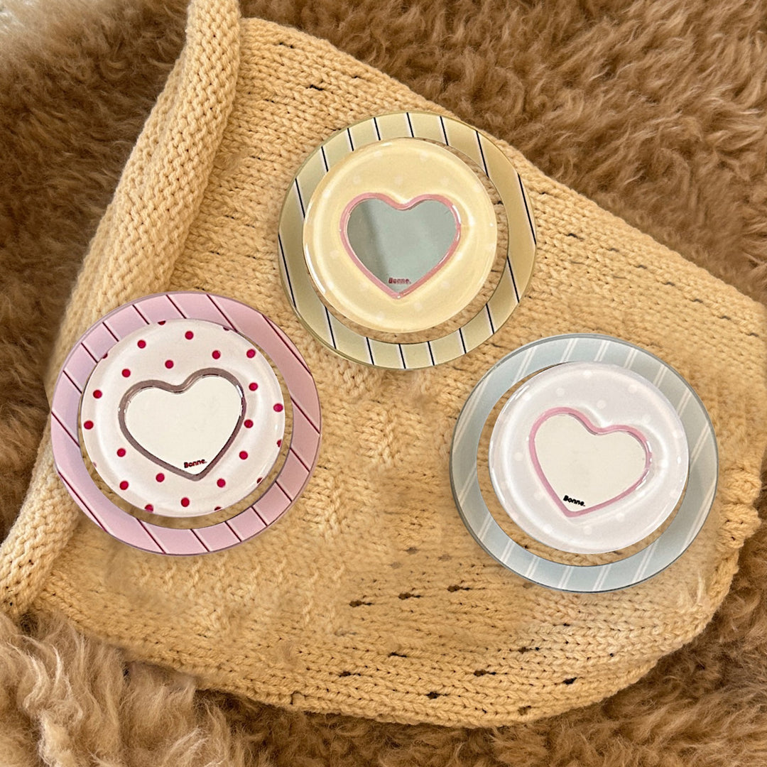Heart-shaped coaster with playful design Kalsten