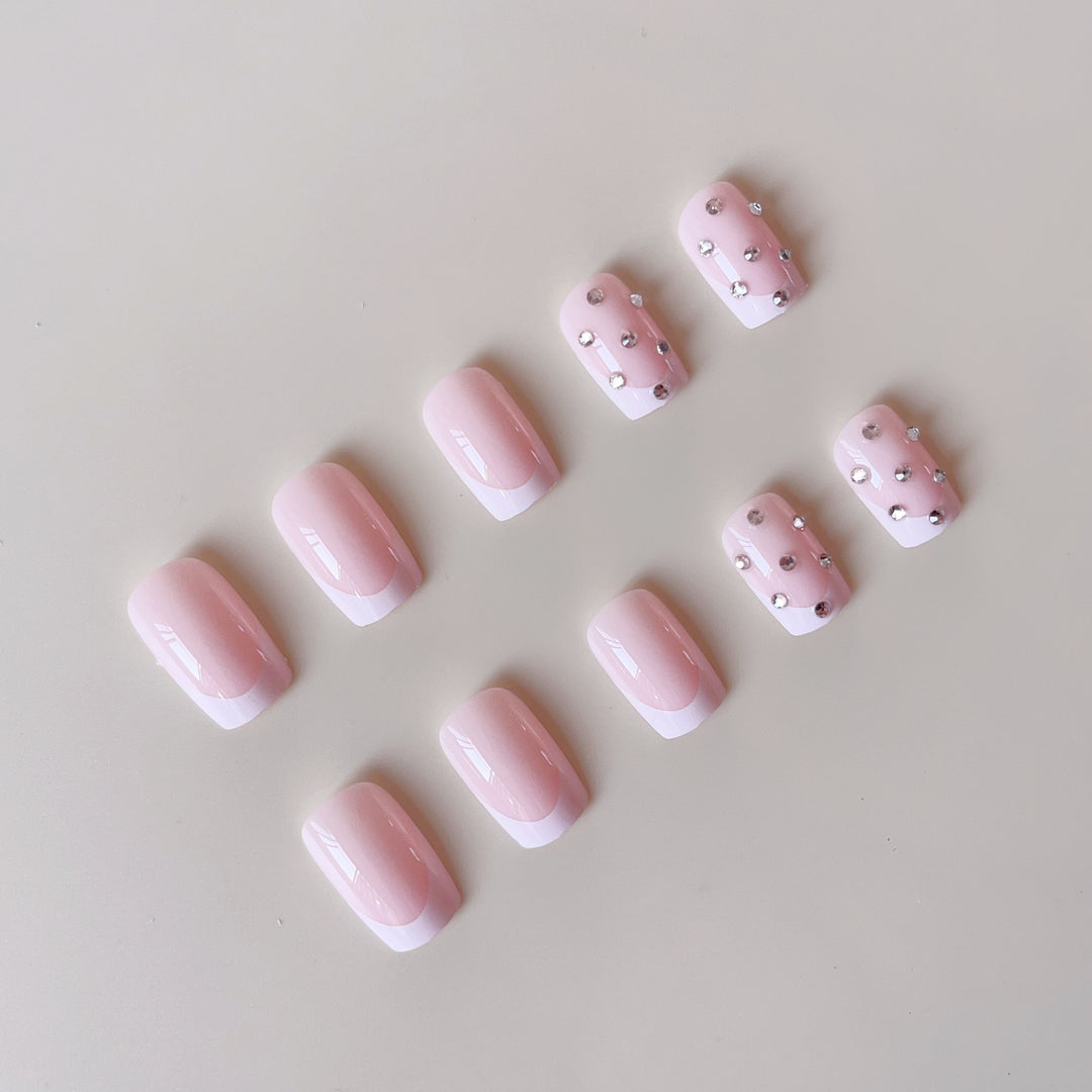 Artificial nail set with elegant rhinestones and French tip decorations Kalsten