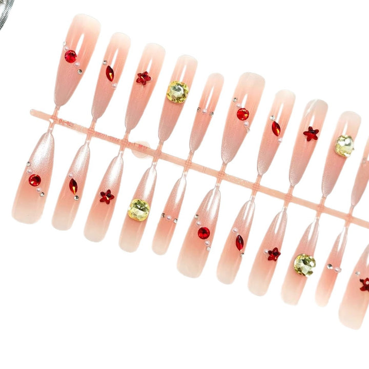 Glamorous artificial nails with shimmering embellishments Kalsten