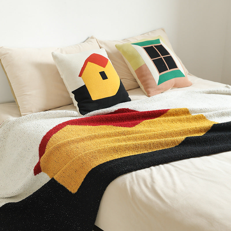 Coarsely woven decorative blanket with geometric jacquard pattern and soft bouclé Kalsten