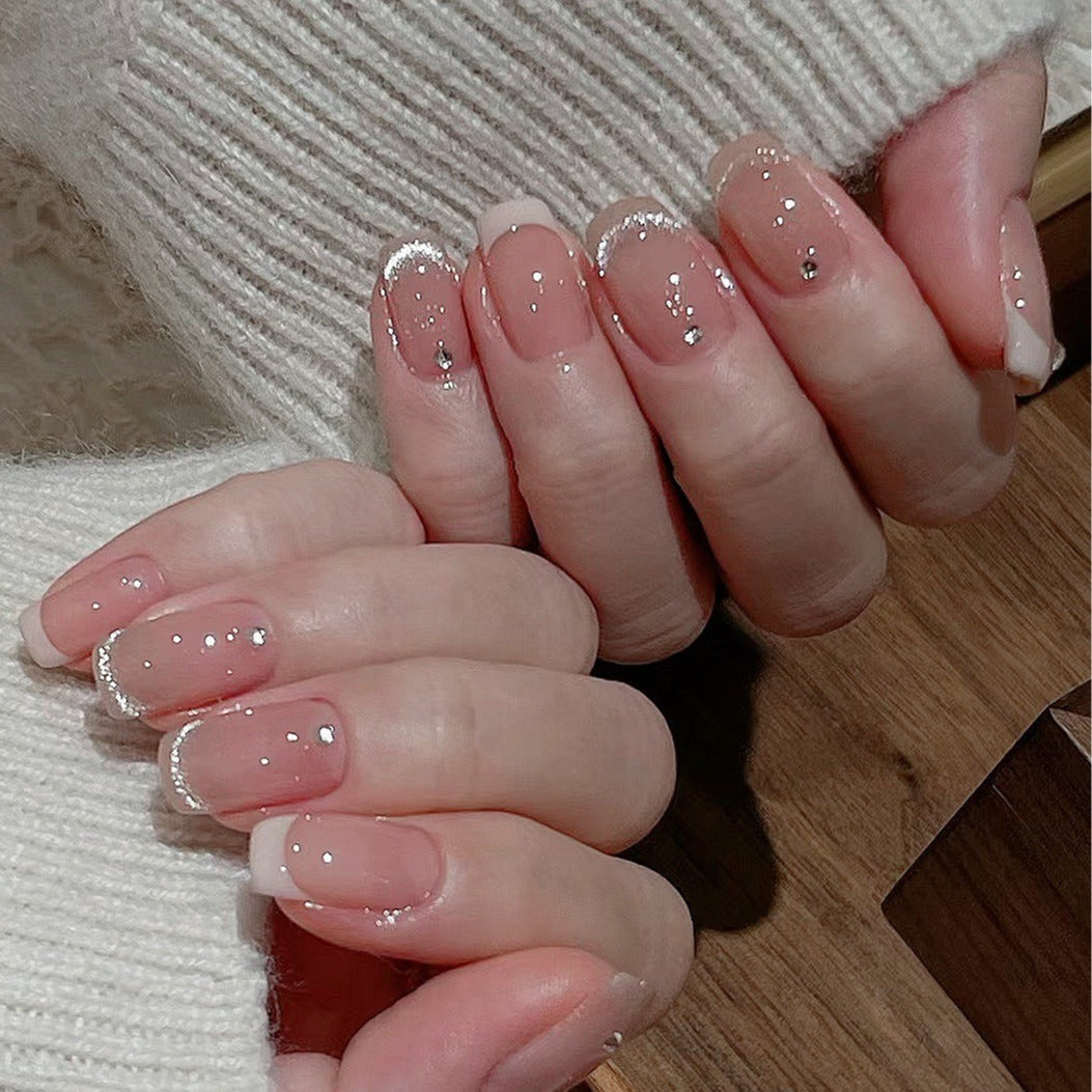 Glamorous artificial nails with filigree rhinestone details Kalsten