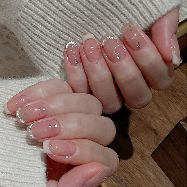 Glamorous artificial nails with filigree rhinestone details Kalsten