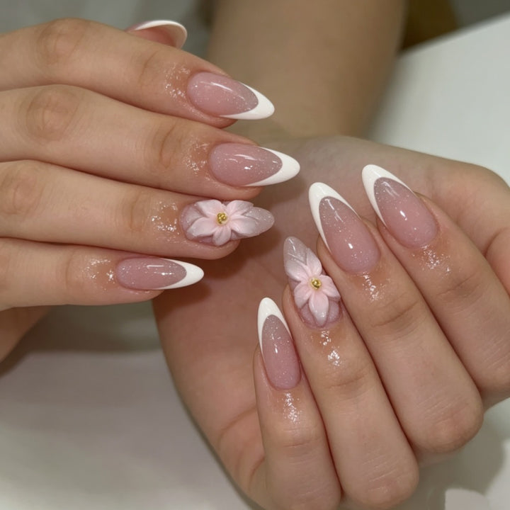 Artificial nails with floral decoration and elegant French tip design Kalsten