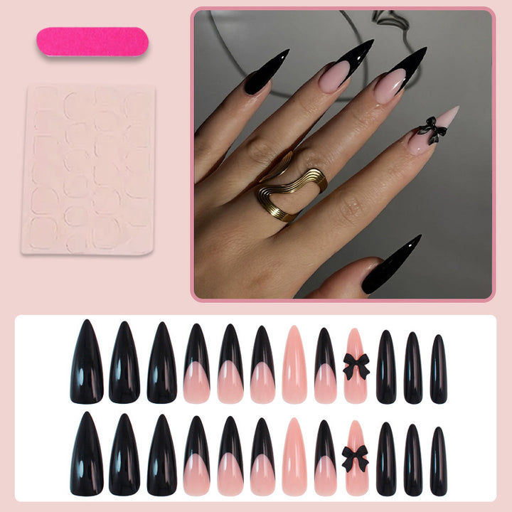 Acrylic nail set with elegant black-and-white design and playful accents Kalsten