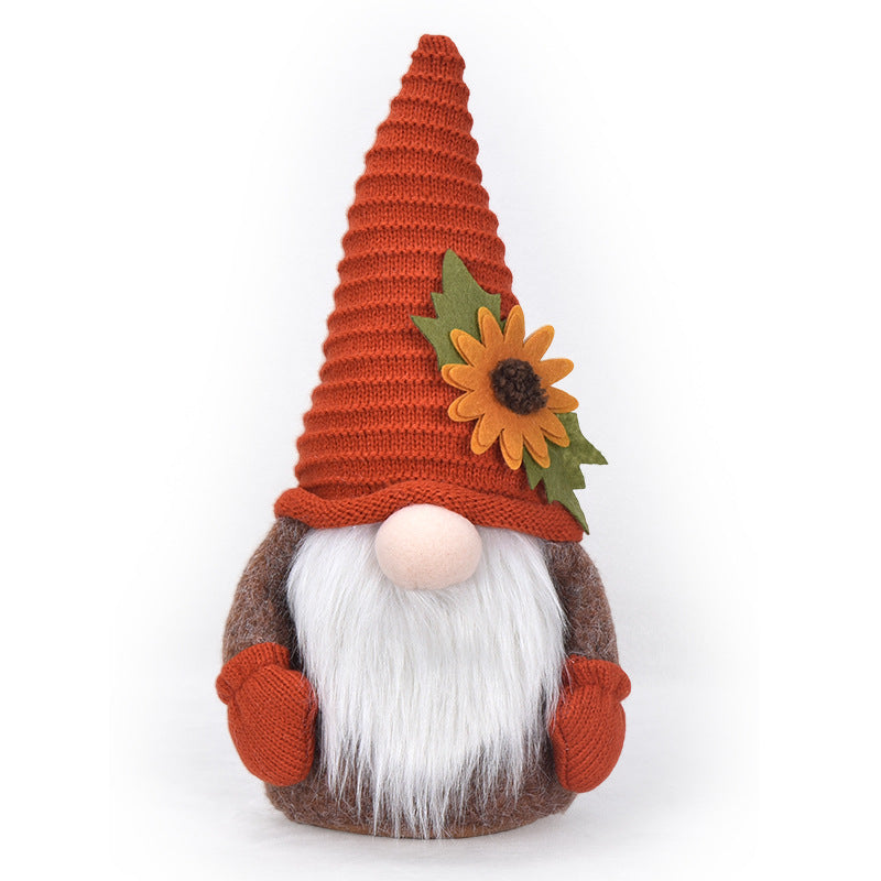 Autumn handmade decorative gnome figure with knitted hat, felt leaf application and pumpkin detail