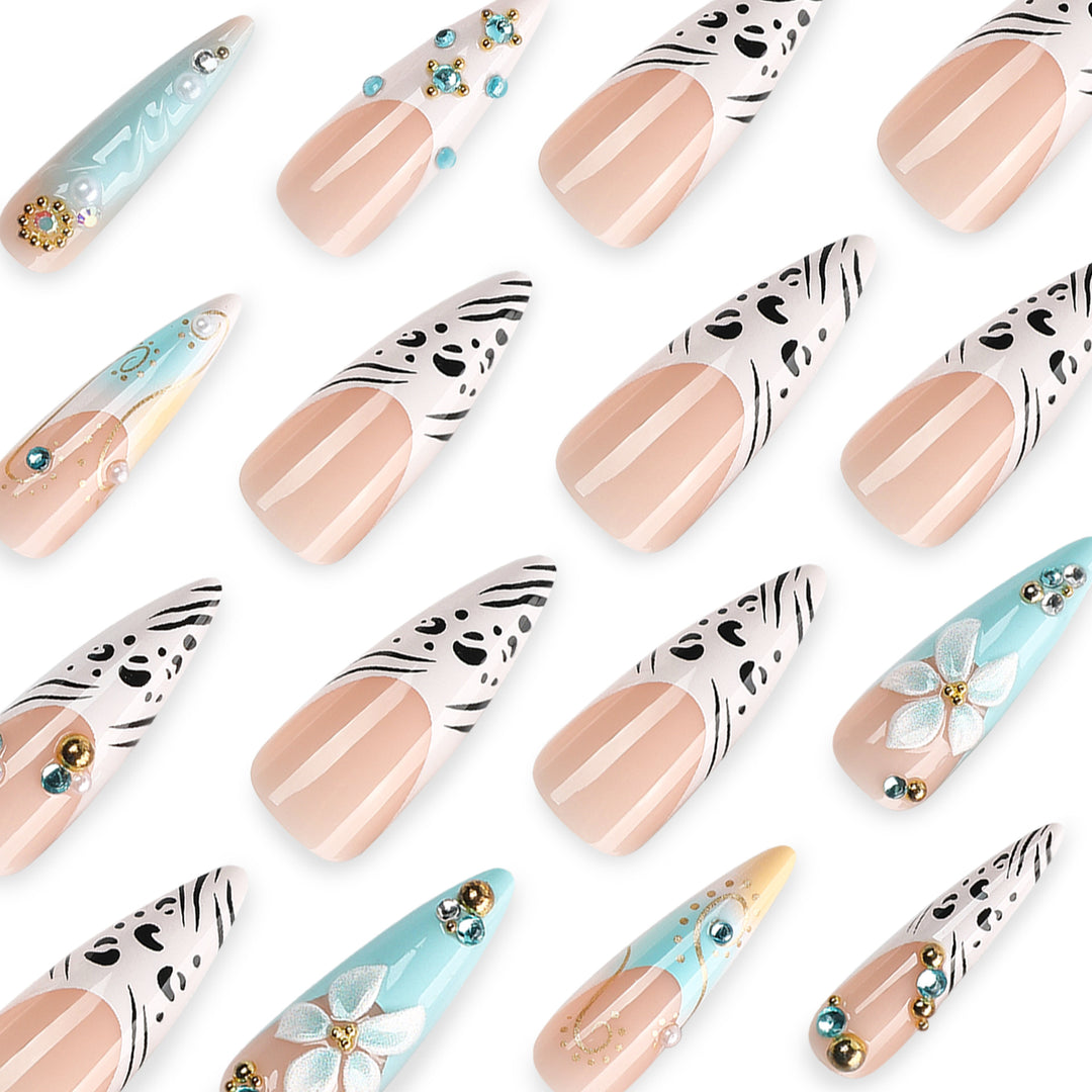 Artistic stiletto nails with floral accents and glitter details Kalsten