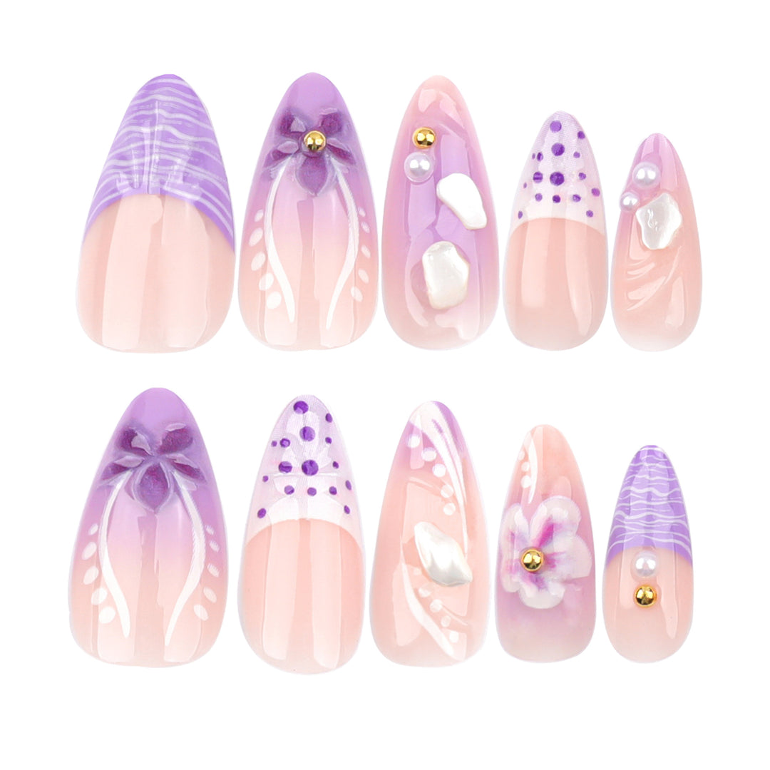Artful nail extensions with elegant floral embellishments Kalsten